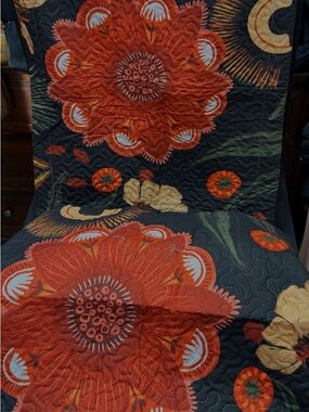 Black Quilt with Bold Red Floral Motif